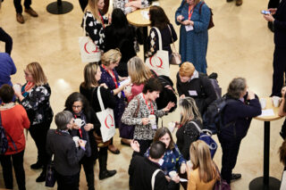 Q members networking at an event
