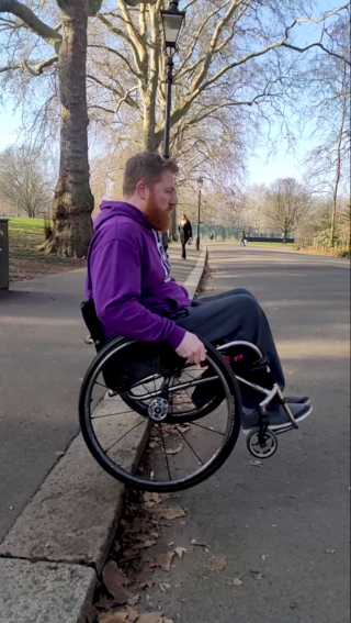 Pete demonstrates how to navigate a kerb in a wheelchair